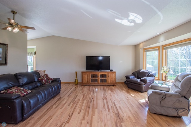 6673 230th St N, Cromwell Twp, MN 56549 - living room with vaulted ceiling, plenty of natural light, light wood-type flooring, a ceiling fan, and baseboards