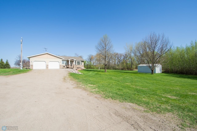 6673 230th St N, Cromwell Twp, MN 56549 - single story home featuring a garage, dirt driveway, and a front yard
