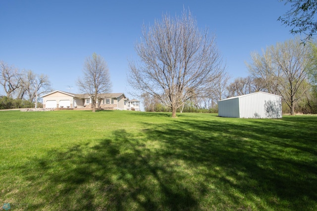 6673 230th St N, Cromwell Twp, MN 56549 - view of green lawn with a pole building and an outdoor structure