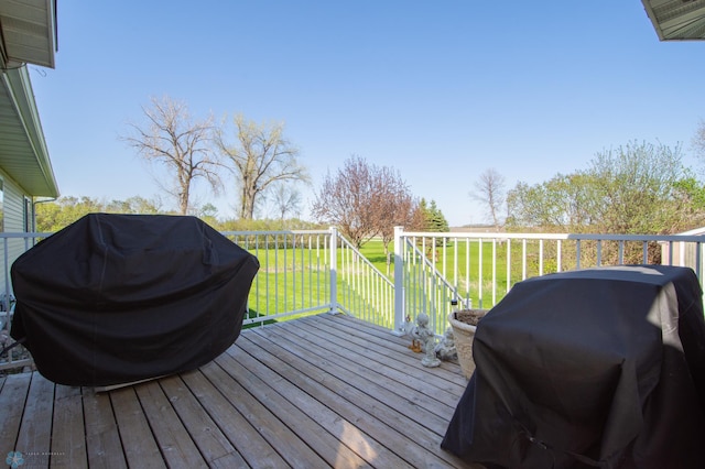 6673 230th St N, Cromwell Twp, MN 56549 - wooden deck featuring area for grilling and a lawn