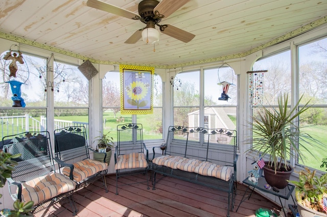 6673 230th St N, Cromwell Twp, MN 56549 - sunroom with a ceiling fan and an outdoor living space