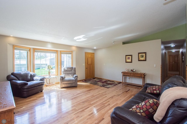 6673 230th St N, Cromwell Twp, MN 56549 - living area featuring light wood finished floors and vaulted ceiling