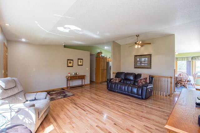 6673 230th St N, Cromwell Twp, MN 56549 - living area with vaulted ceiling, light wood-style floors, a ceiling fan, and baseboards