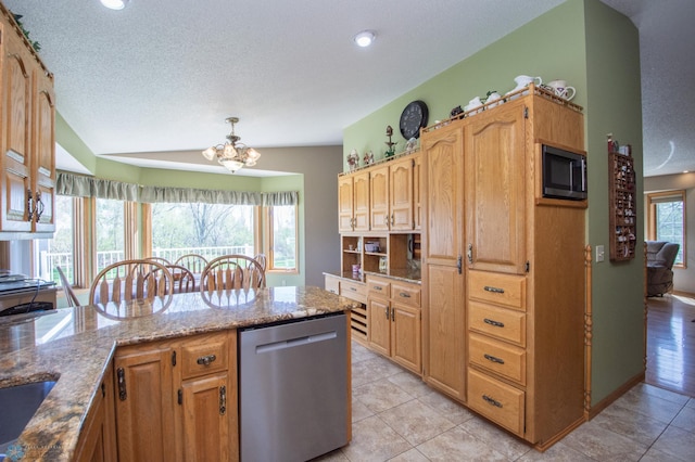 6673 230th St N, Cromwell Twp, MN 56549 - kitchen with dishwasher, built in microwave, light stone counters, a chandelier, and light tile patterned floors