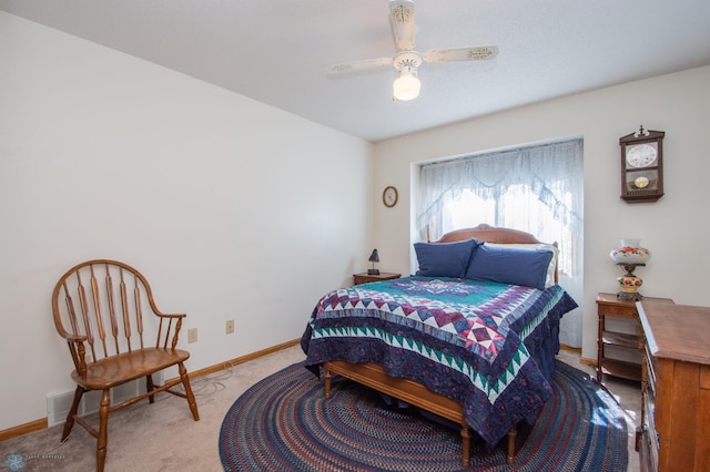 6673 230th St N, Cromwell Twp, MN 56549 - bedroom with light carpet, baseboards, and ceiling fan
