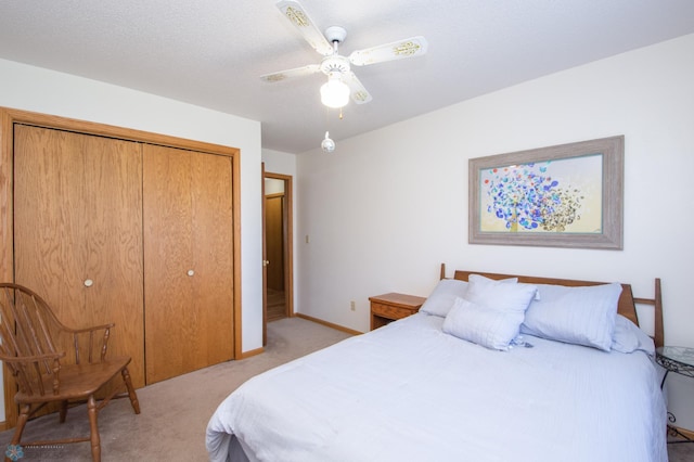 6673 230th St N, Cromwell Twp, MN 56549 - bedroom featuring light colored carpet, a closet, a ceiling fan, and baseboards