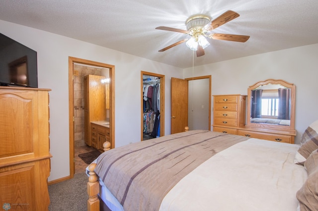 6673 230th St N, Cromwell Twp, MN 56549 - bedroom with carpet, a walk in closet, ensuite bath, a closet, and a ceiling fan