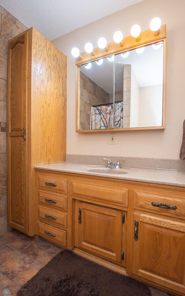 6673 230th St N, Cromwell Twp, MN 56549 - bathroom featuring vanity and a textured ceiling