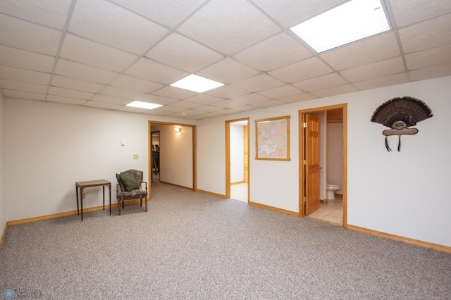 6673 230th St N, Cromwell Twp, MN 56549 - unfurnished room featuring a drop ceiling, light colored carpet, and baseboards