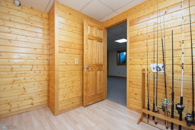 6673 230th St N, Cromwell Twp, MN 56549 - corridor featuring wood finished floors, wood walls, and a drop ceiling