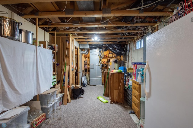 6673 230th St N, Cromwell Twp, MN 56549 - below grade area featuring freestanding refrigerator and heating unit