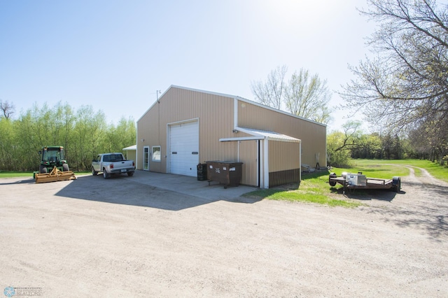 6673 230th St N, Cromwell Twp, MN 56549 - view of outdoor structure featuring an outbuilding and dirt driveway