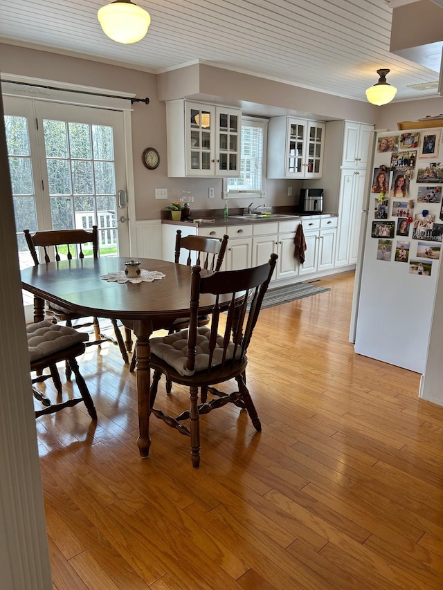 12176 2nd St, Northome, MN 56661 - dining space featuring wainscoting and light wood finished floors