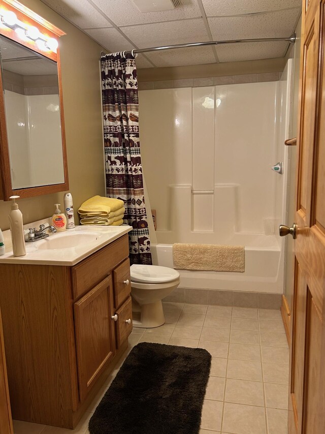 12176 2nd St, Northome, MN 56661 - bathroom with tile patterned floors, shower / bathtub combination with curtain, toilet, vanity, and a drop ceiling