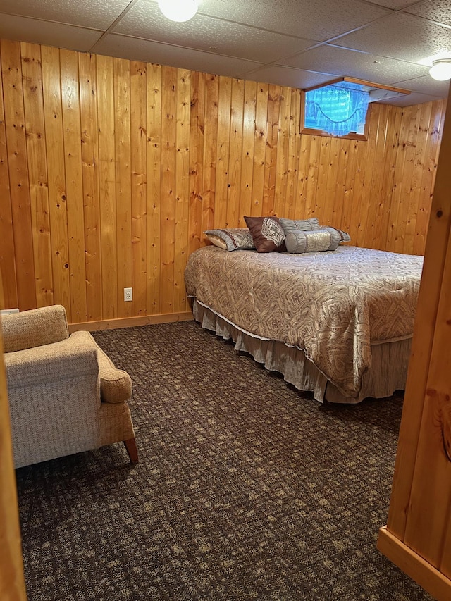 12176 2nd St, Northome, MN 56661 - carpeted bedroom featuring a paneled ceiling and wooden walls