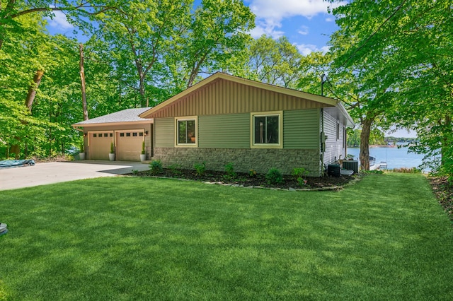 49935 Acacia Trl, Nessel Twp, MN 55080 - ranch-style home featuring stone siding, a water view, a front yard, and a garage