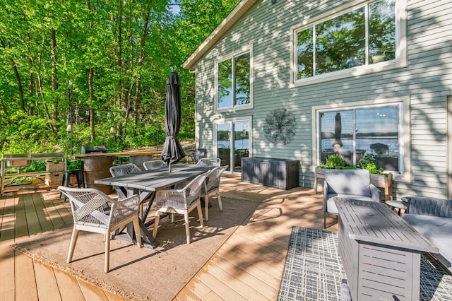 49935 Acacia Trl, Nessel Twp, MN 55080 - deck with outdoor dining space and an outdoor hangout area