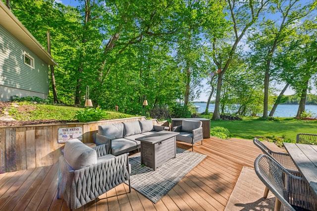 49935 Acacia Trl, Nessel Twp, MN 55080 - deck featuring an outdoor hangout area, a water view, and a lawn