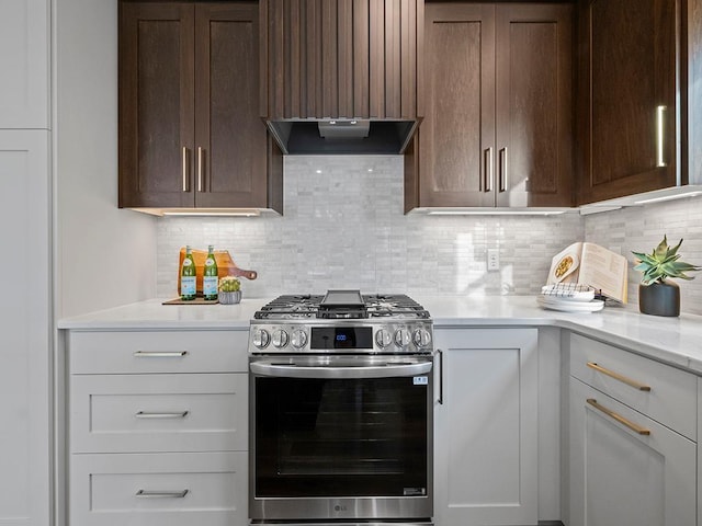 9975 Kari Way, Elko New Market, MN 55020 - kitchen with stainless steel gas range oven, decorative backsplash, dark brown cabinetry, ventilation hood, and light stone counters