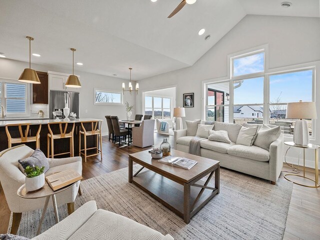 9975 Kari Way, Elko New Market, MN 55020 - living room featuring wood finished floors, a chandelier, recessed lighting, ceiling fan, and high vaulted ceiling