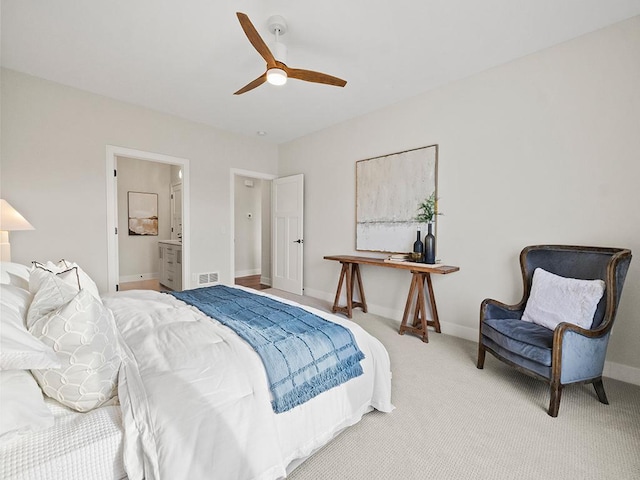 9975 Kari Way, Elko New Market, MN 55020 - bedroom featuring light colored carpet, baseboards, ceiling fan, and connected bathroom