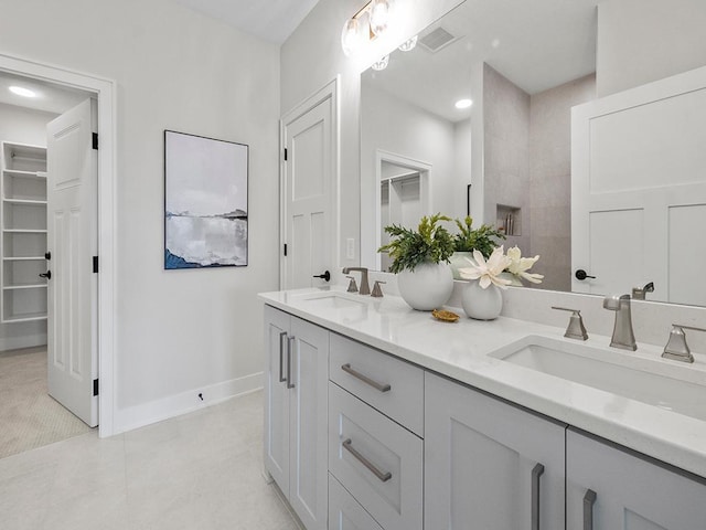 9975 Kari Way, Elko New Market, MN 55020 - bathroom featuring double vanity and a spacious closet