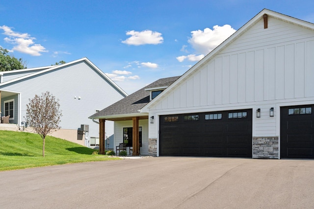 9975 Kari Way, Elko New Market, MN 55020 - modern inspired farmhouse with stone siding, board and batten siding, roof with shingles, and an attached garage