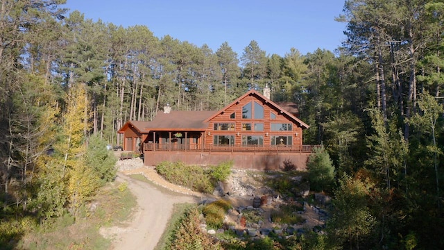 7236 Far N Rd, Buyck, MN 55771 - back of property featuring a wooded view and log siding