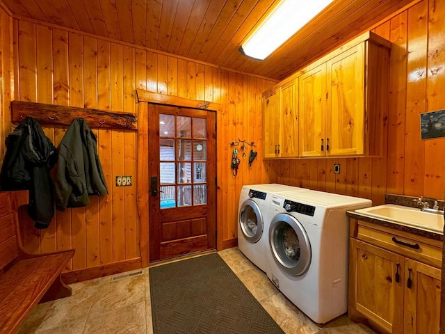 7236 Far N Rd, Buyck, MN 55771 - washroom with cabinet space, wooden walls, wooden ceiling, and separate washer and dryer