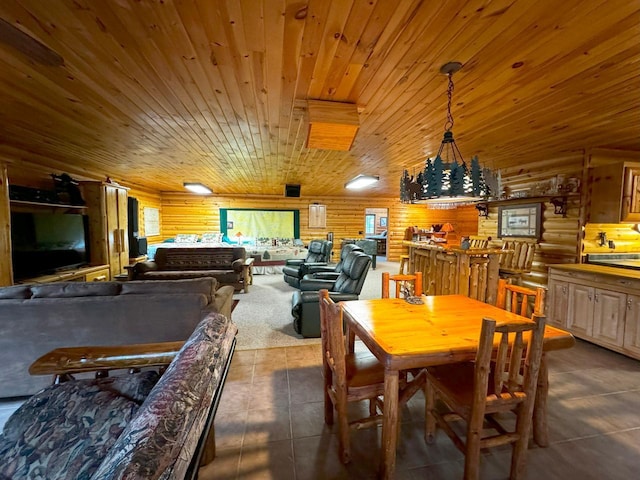 7236 Far N Rd, Buyck, MN 55771 - dining area featuring rustic walls, wooden ceiling, and dark tile patterned floors