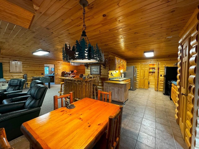7236 Far N Rd, Buyck, MN 55771 - dining area featuring rustic walls and wood ceiling