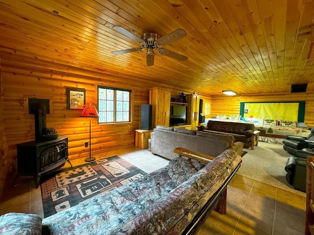 7236 Far N Rd, Buyck, MN 55771 - tiled living area with wood ceiling, a ceiling fan, and a wood stove