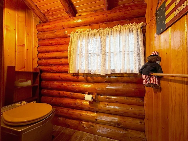 7236 Far N Rd, Buyck, MN 55771 - bathroom with wood finished floors, log walls, and wooden ceiling