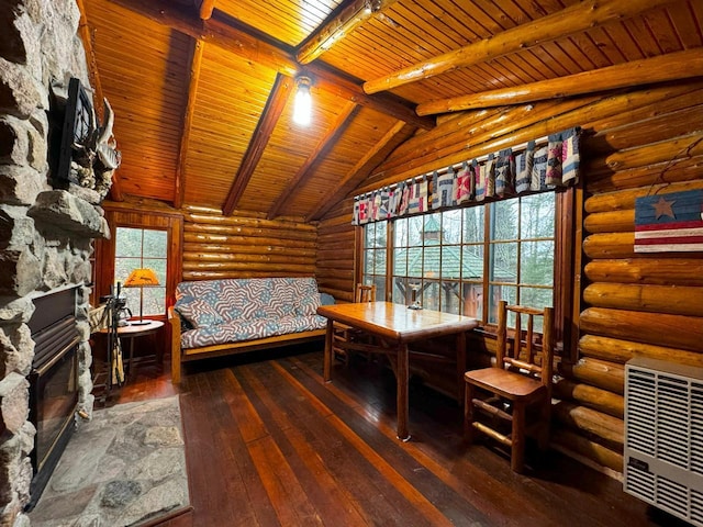 7236 Far N Rd, Buyck, MN 55771 - bedroom featuring wood ceiling, hardwood / wood-style floors, a fireplace, log walls, and heating unit