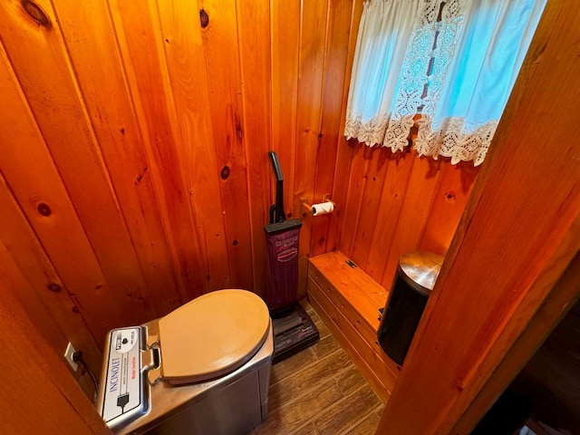 7236 Far N Rd, Buyck, MN 55771 - bathroom with wood walls, toilet, and wood finished floors