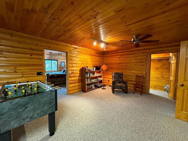 7236 Far N Rd, Buyck, MN 55771 - recreation room featuring wooden ceiling, ceiling fan, carpet, rail lighting, and rustic walls