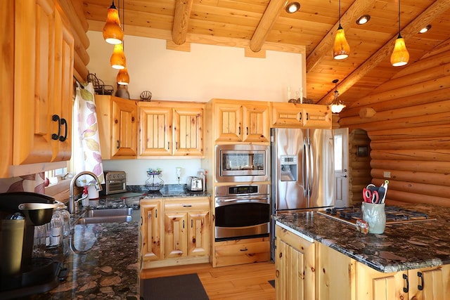 3165 Randa Rd, Orr, MN 55771 - kitchen featuring stainless steel appliances, a sink, log walls, light wood-type flooring, and plenty of natural light