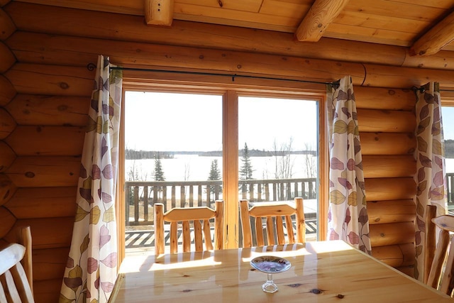 3165 Randa Rd, Orr, MN 55771 - dining room featuring log walls, plenty of natural light, beamed ceiling, and wood ceiling