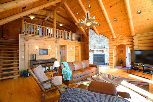 3165 Randa Rd, Orr, MN 55771 - living room with hardwood / wood-style flooring, wood ceiling, a fireplace, high vaulted ceiling, and ceiling fan