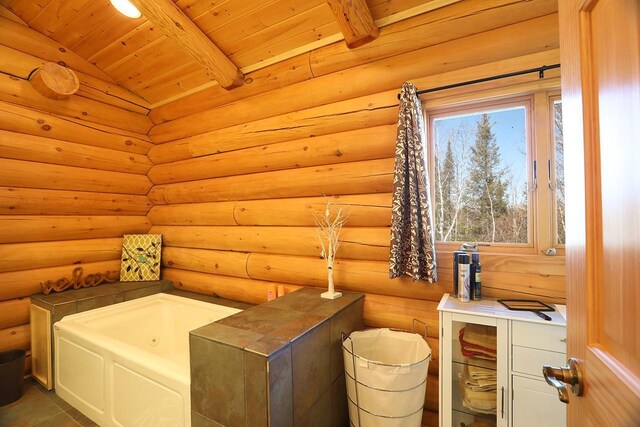 3165 Randa Rd, Orr, MN 55771 - full bath with wood ceiling, a whirlpool tub, beamed ceiling, and rustic walls