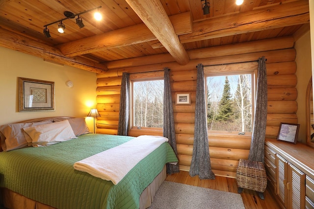 3165 Randa Rd, Orr, MN 55771 - bedroom featuring wooden ceiling, beam ceiling, wood finished floors, and log walls