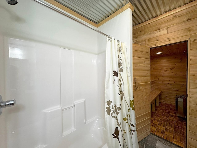 3165 Randa Rd, Orr, MN 55771 - bathroom featuring wooden walls and a shower with curtain