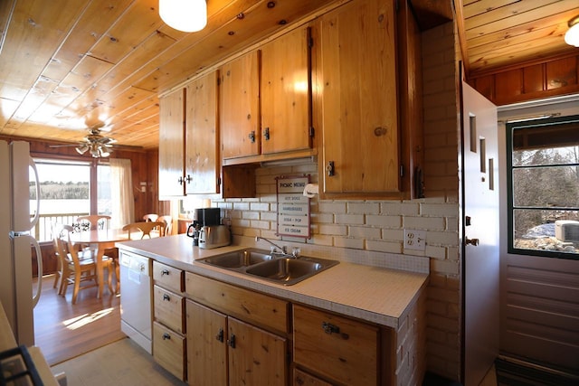 3165 Randa Rd, Orr, MN 55771 - kitchen with white appliances, a sink, wood ceiling, light countertops, and plenty of natural light