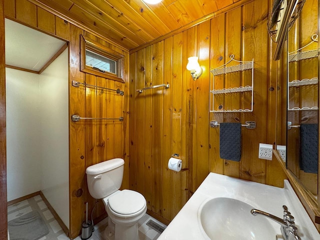 3165 Randa Rd, Orr, MN 55771 - bathroom with a sink, toilet, wood walls, wooden ceiling, and baseboards