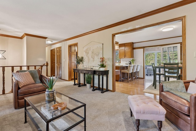 living area with light carpet and ornamental molding