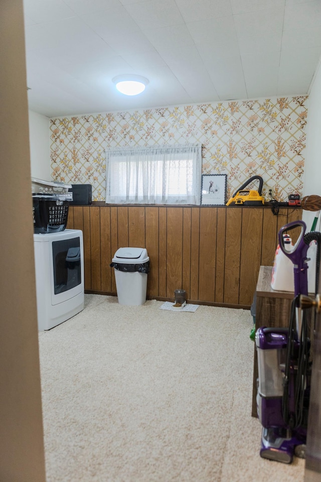 interior space featuring wallpapered walls, washer / clothes dryer, and carpet flooring