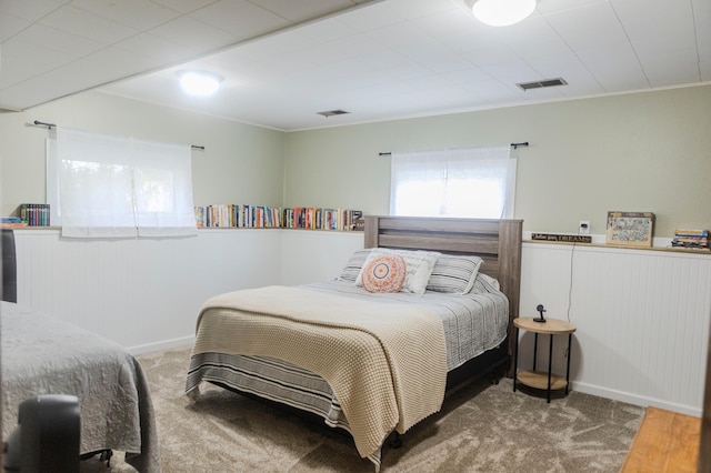 carpeted bedroom with baseboards