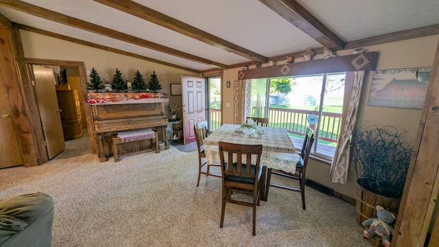 view of carpeted dining area