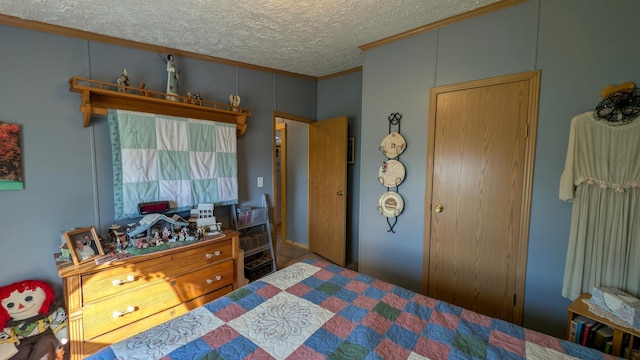 bedroom featuring crown molding and a textured ceiling