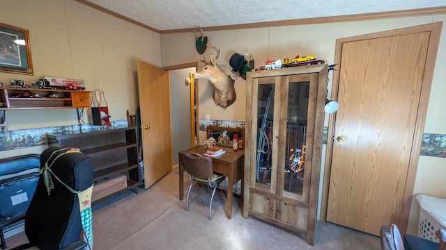 home office featuring carpet, ornamental molding, and a textured ceiling